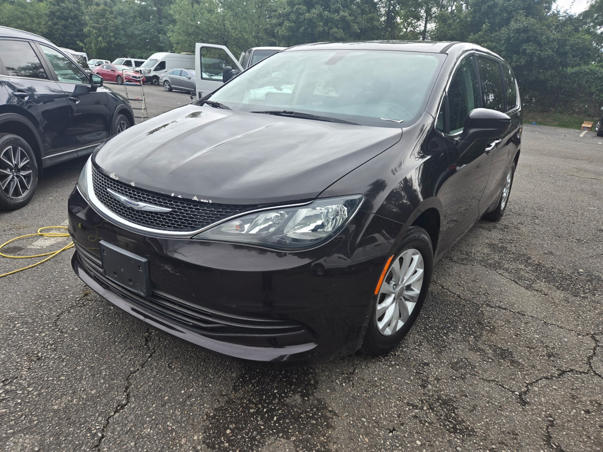 Dark Chrysler Pacifica minivan cleaned inside and out at the customer's location
